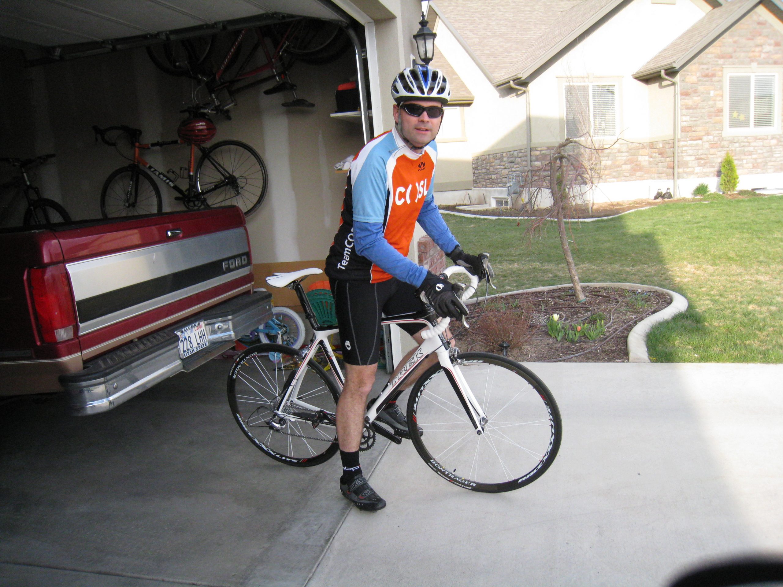 Justin looking at camera while standing on bike getting ready to say something